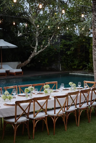 Outdoor long-table dinner setup for a celebration at Villa Zambala Canggu