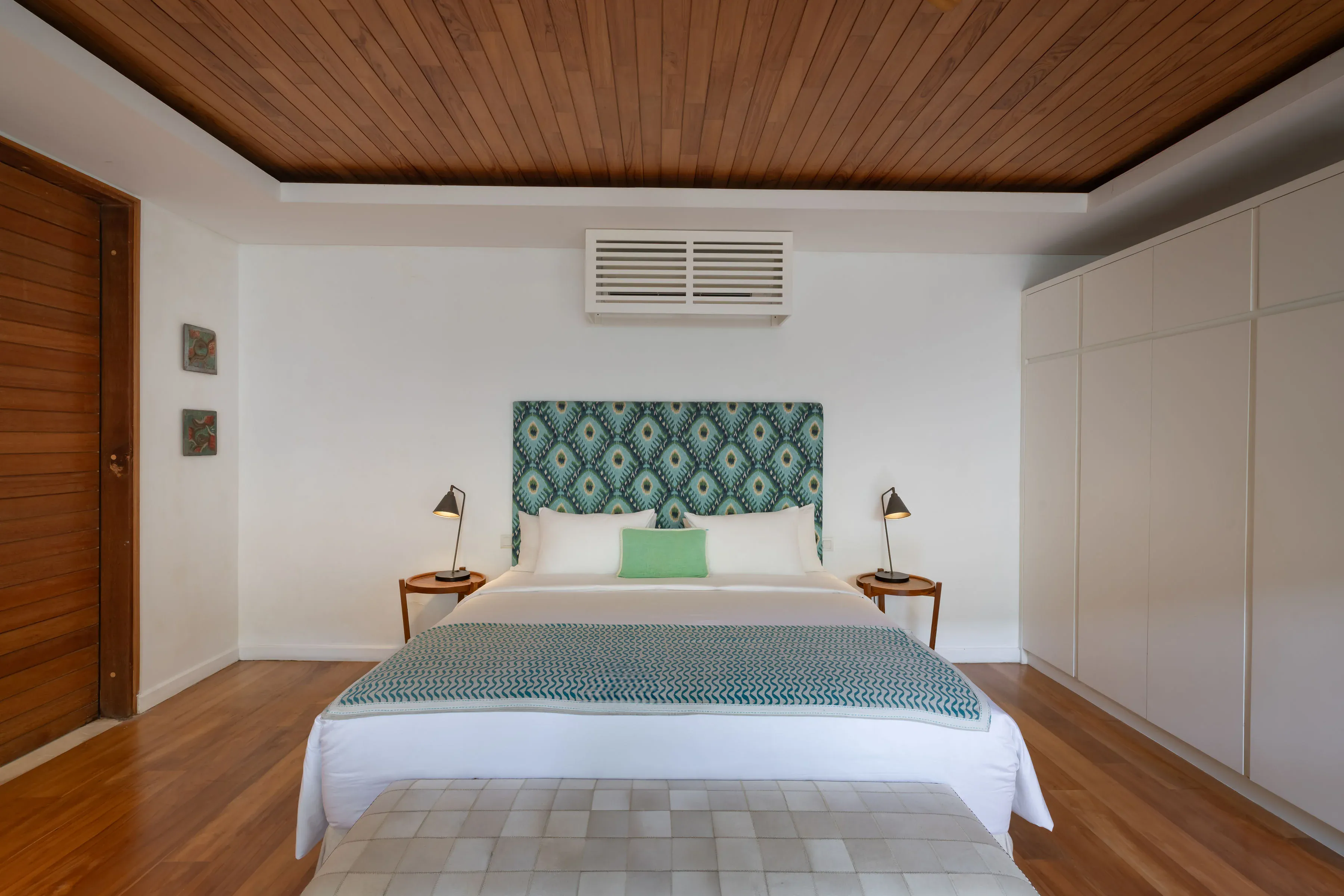 King bed and interiors in poolside room at Villa Zambala Canggu