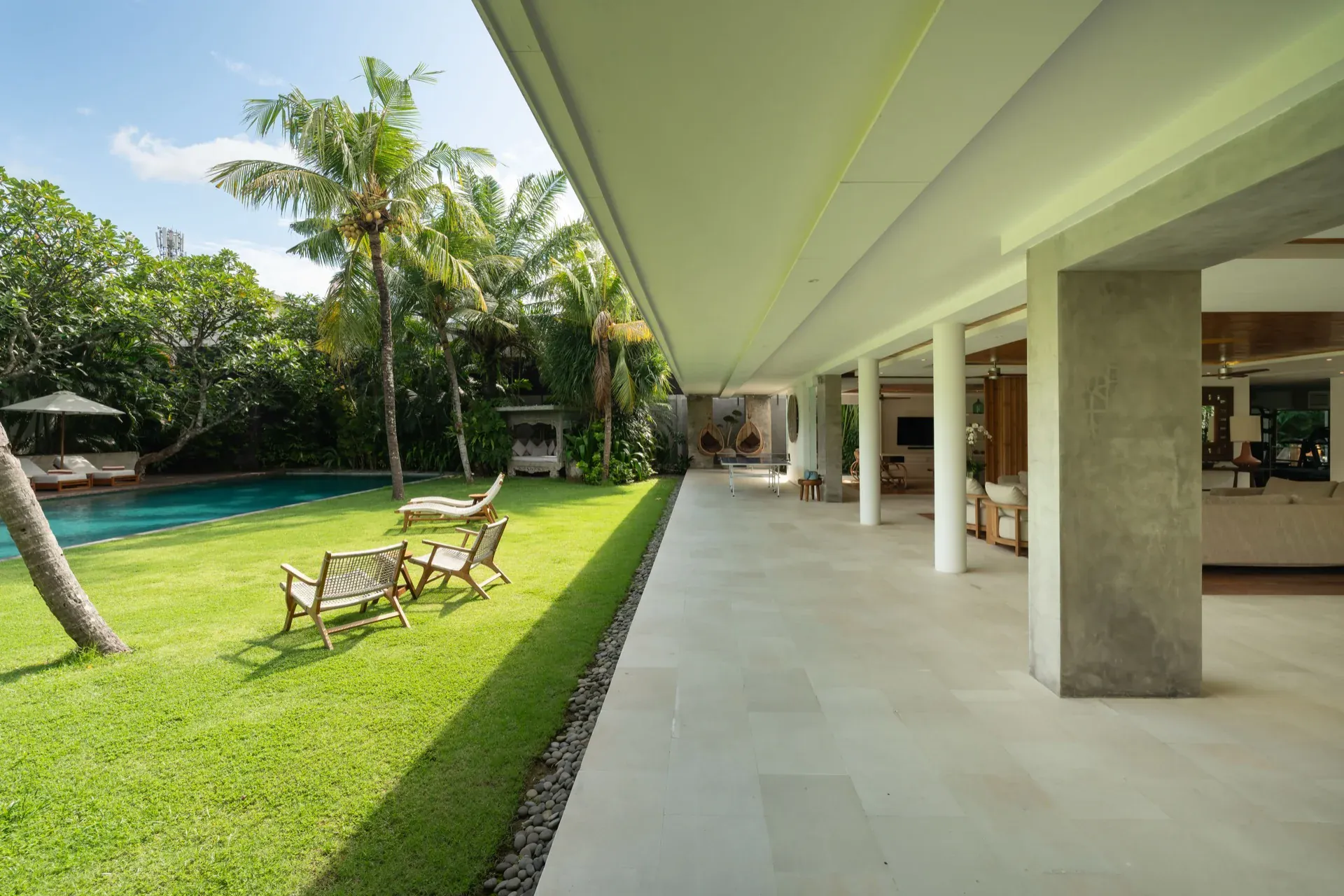 Sun loungers beside the pool at Villa Zambala