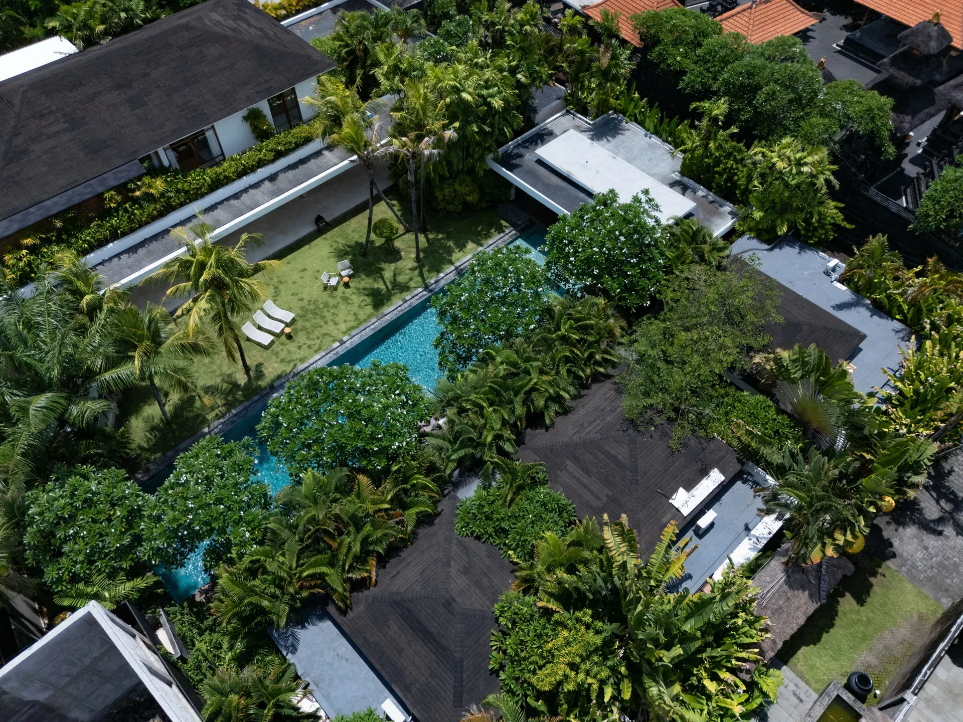 Poolside view with tropical landscaping at Villa Zambala